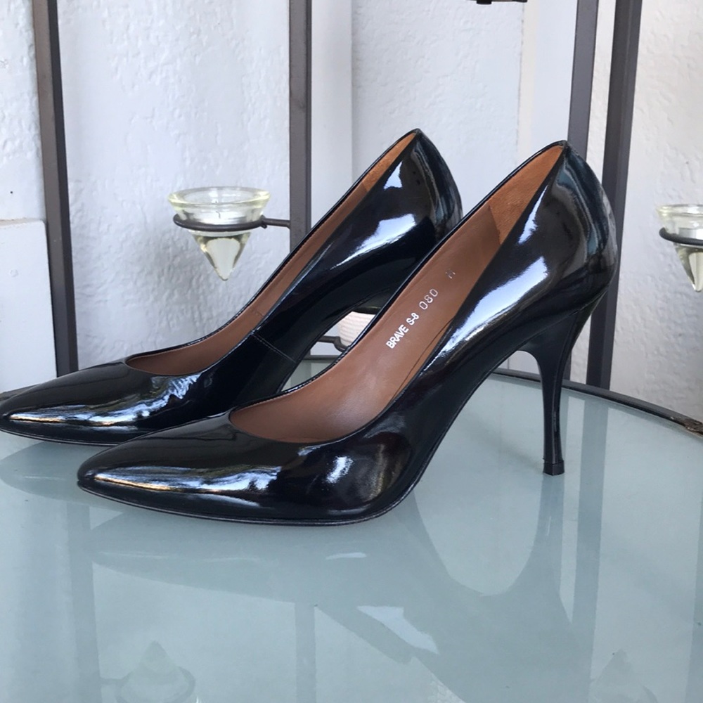 Donald J Pliner black patent leather pumps.